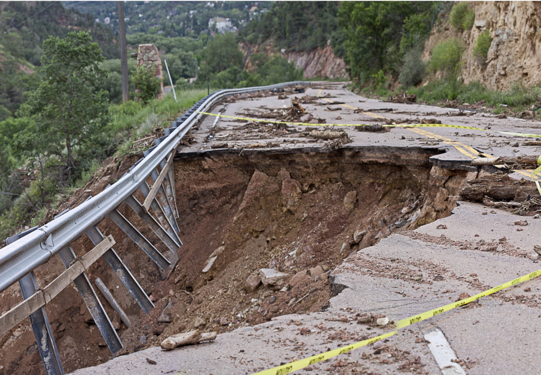 Road severely damaged by erosion or earthquake to promote Greenfield Risk Solutions Insurance Brokers